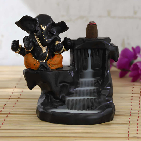 eCraftIndia Lord Orange Ganesha Smoke Backflow Cone Incense Holder Decorative Showpiece with 10 free Smoke Backflow Scented Cone Incenses.